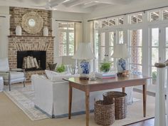 a living room filled with furniture and a fire place