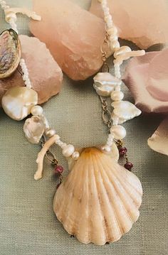 Ocean-inspired Pearl Pendant Jewelry, Unique Handmade Baroque Pearl Necklace, Handmade Unique Baroque Pearl Necklace, Handmade Shell-shaped Pearl Necklace, Handmade Shell-shaped Pearl Necklace For Gift, Handmade Shell-shaped Pearl Necklace Gift, Ocean-inspired Mother Of Pearl Jewelry With Pearl Charm, Elegant Pearl Strand Jewelry, Handmade Baroque Pearl Shell Jewelry