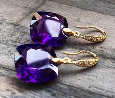 "Purple Amethyst earrings. Gold Pave earrings. Ultra violet. Statement jewelry. February birthday. Deep purple stones and yellow gold are luxury and beautiful together- royal combination of colors. I have only two pairs of earrings , so choose a stone: A) 36 carats both, each is 17x17x11 mm. B) 25 carats both, each is 16x16x10 mm. As photo. Length of earrings is about 1 1/3\". Available in different finishes. They will arrive in a beautiful jewelry box." Elegant Amethyst Earrings For Party, Gold Amethyst Earrings For Parties, Amethyst Gemstone Earrings For Party, Luxury Gold Amethyst Earrings, Elegant Amethyst Purple Earrings, Purple Fine Jewelry Earrings For Gift, Elegant Purple Amethyst Earrings, Elegant Purple Earrings With Prong Setting, Luxury Amethyst Earrings For Gift