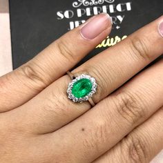 "ENJOY OUR WORRY-FREE SERVICE AND THE DAZZLING, GENUINE JEWELRY WE DESIGN AND HANDCRAFT WITH LOVE❤️ ABOUT THE ITEM: This ring is the perfect combination of elegance, simplicity, and INVESTMENT VALUE! With a CLEAN 1.18 carats, VIVID COLOMBIAN GREEN emerald, and 14 extremely sparkling diamonds. The ring was deliberately designed and handcrafted by our boutique's in-house goldsmiths. You will love this gorgeous piece as much we do. And people will absolute adore it once they see the sparkle and the White Gold Brilliant Cut Emerald Ring For Proposal, Dazzling Wedding Emerald Ring In Platinum, Dazzling Platinum Emerald Wedding Ring, Gia Certified Silver Emerald Ring As Gift, Classic White Gold Emerald Ring For Proposal, Gia Certified White Gold Halo Ring For Gift, Dazzling White Gold Emerald Ring With Round Cut, Gia Certified Emerald Ring For Gift, Gia Certified Silver Emerald Ring In 14k White Gold