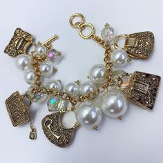 Pearl charm bracelet, allow 2-3 business days for delivery. Elegant Metal Charm Bracelet With Removable Charms, Classic Metal Bracelets With Charms, White Metal Charm Bracelet, Adjustable Jewelry With Removable Charms, Metal Pearl Charm Bracelet, Everyday Metal Jewelry With Pearl Charm, Adjustable Metal Jewelry With Removable Charms, Adjustable Metal Charm Bracelet With Removable Charms, Elegant Gold Pearl Bracelet With Charms