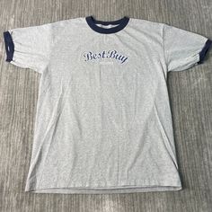 Vintage 2000s Best Buy Spell Out Store Basic Essential Streetwear Y2K Aesthetic Grey Graphic Ringer T Shirt Large Mens Condition:  Excellent Used Condition  = No Flaws Measurements: Please see photos above for all measurements IF YOU BUY TWO OR MORE ITEMS USE THE CODE BUNDLE @ CHECK TO SAVE 20% WE SHIP WITHIN 24 HOURS AFTER PURCHASE! Please be aware that we do not offer free returns!! The Buyer is responsible for the cost of the return label.  Follow us on TikTok & Instagram @findsnostalgic and Gray Y2k T-shirt For Streetwear, Gray Y2k Style T-shirt For Streetwear, 90s Style Gray Cotton Tops, Y2k Style Cotton Tops For College, Aesthetic Grey, Streetwear Y2k, Vintage 2000s, Best Buy, Y2k Aesthetic