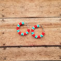 Welcome to Midwestern Chic Design! Cheer on the KC Current Women's soccer team this season with these red and teal earrings. These heishi bead earrings are lightweight and easy to wear with the lever back closure. These are silver hypoallergenic hoops. They are made of durable alloy, are nickel- and lead-free for sensitive skin. Adjustable Red Hoop Earrings, Red Bohemian Small Hoop Earrings, Bohemian Red Small Hoop Earrings, Handmade Red Hoop Earrings For Festive Occasions, Handmade Red Small Hoop Earrings, Traditional Handmade Red Hoop Earrings, Festive Red Hoop Earrings, Heishi Bead Earrings, Kc Current