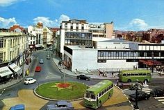 an aerial view of a city street with cars and buses