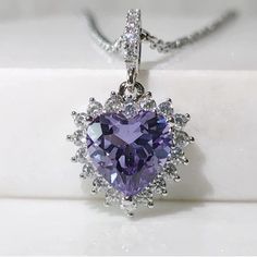 Nwot Vintage Heart Center Stone With Lab Grown Color Change Purple Blue Alexandrite And 14k White Gold. The Setting Is Vermeil 14k White Gold Over 925 Sterling Silver To Last A Lifetime. * Approx 4 Cttw * 3 Cttw Lab Brown Color Change Alexandrite * 1 Cttw Simulated White Diamonds * 14k White Gold Vermeil Plated * 925 Sterling Silver Hallmark Stamped Measurements Are Approximate Purple Gem Necklace, Purple Sterling Silver Heart Cut Necklace, Purple Heart Cut Sterling Silver Necklace, Purple Heart-cut Sterling Silver Necklace, Elegant Heart-shaped Amethyst Necklace, Heart Cut Purple Jewelry For Valentine's Day, Purple Heart Cut Jewelry For Valentine's Day, Formal Purple Heart Pendant Necklace, Purple Heart Pendant Necklace For Formal Occasions