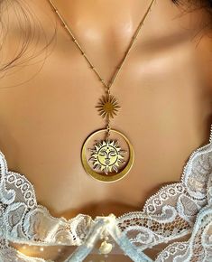 "Long, fashion, celestial, brass, statement pendant necklace, sun goddess and goddess of shooting stars; \"Novum,\" (aka Alectrona and Asteria). 16\" inches long chain. Total drop length: 3.20\" x 1.80\" inches." Bohemian Gold-tone Necklace For Gift, Nickel-free Gold-tone Brass Necklace, Celestial Brass Jewelry, Celestial Metal Necklace With Moon Phase, Gold Moon-shaped Bohemian Jewelry, Celestial Gold Jewelry For Festivals, Gold Moon-shaped Festival Jewelry, Celestial Metal Moon Phase Necklace, Bohemian Moon-shaped Gold Jewelry