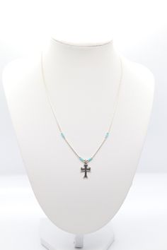 This beautiful turquoise beaded silver cross necklace is the perfect accessory for any occasion. It's sure to become a favorite. Spiritual Beaded Cross Pendant Necklace, Spiritual Beaded Cross Pendant Jewelry, Silver Beaded Cross Pendant Necklace, Silver Beaded Cross Pendant Jewelry, Blue Bohemian Necklace With Cross Pendant, Cross Necklace With Silver Beads For Gift, Beaded Cross Pendant Jewelry Gift, Bohemian Beaded Cross Necklace, Bohemian Blue Cross Pendant Necklace