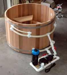 a large wooden tub sitting inside of a building