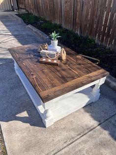 a coffee table made out of wood and white paint