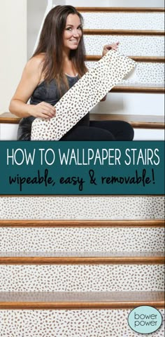 a woman sitting on the stairs holding up a piece of wallpaper with text overlay reading how to wallpaper stairs wipeable easy & removable