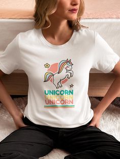 Unleash your magical side with our "Triple Unicorn Magic" t-shirt! This enchanting design features a beautifully illustrated unicorn above the word "unicorn" repeated three times for extra charm. Perfect for dreamers and fantasy lovers, this tee brings out the wonder and whimsy in anyone who wears it. Made from soft, premium fabric for ultimate comfort, it's a stylish and fun addition to your wardrobe. Whether you're a fan of unicorns or just love a touch of magic, this shirt is the perfect way to express your mythical style! Order and Shipping: * All our t-shirts are made to order, leveraging our order on demand printing partners * Please allow 1-3 days for production and 2-5 business days for standard shipping. Please reference expected shipping times for your location during checkout. P Fun Unicorn Print T-shirt For Summer, Cute Unicorn Print Summer T-shirt, Fun Summer T-shirt With Unicorn Print, White Unicorn Print T-shirt For Summer, Summer Unicorn Print Short Sleeve T-shirt, Summer Unicorn Print Crew Neck Top, Summer Short Sleeve Unicorn Print T-shirt, Casual Multicolor Unicorn Print T-shirt, Summer White T-shirt With Unicorn Print