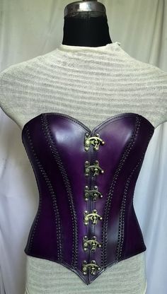 It is handmade leather corset with hand-sewn leather detailing. At front is closed with Lock and back side is adjustable with buckles. We used about 2 to 2.2 mm thick handmade leather. It is hand dyed handmade leather. It is crazy for Gothic, Steampuck costumes and medieval events and Larp.   Corset is hand made from sturdy top-grain leather.  Size is available from 30 to 46 inch, please check our size chart. Bust size in size-chart. DETAILS: ► 100% Handmade ► 100% Genuine leather ► Made on your Armour Corset, Womens Armor, Pirate Corset, Leather Armour, Corset Steampunk, Barbie Fashion Sketches, Purple Gothic, Purple Corset, 18th Century Dress