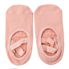 two pairs of pink baby shoes with bows on the toes and one pair is closed