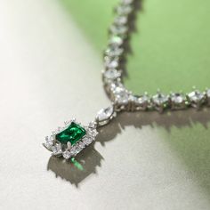 You'll be dazzled and delighted with the shimmering look of this striking necklace. This necklace features a row of round and princess cut stones radiate optimal shimmer. Its pendant is a sparkling emerald-green radiant cut stone. Uniquely designed, each shimmering stone is set to appear extra large and more brilliant, creating twice the sparkle. It's a sweet and romantic gift for you or your loved ones.Carat Weight: 1.5 ctStone Size: 5*7 mmStone Type: Jeulia® StoneNumber of Stones: 1 Stone Shap Radiant Cut, Romantic Gift, Love At First Sight, 1 Carat, Princess Cut, Emerald Green, Sterling Silver Necklaces, Emerald, Silver Necklace