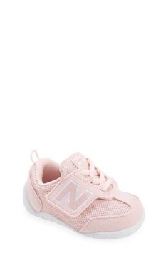 Baby's first steps will be supported in this sporty sneaker featuring a roomy toe box and easy-on/off strap. Adjustable hook-and-loop strap Removable insole Textile and leather upper/synthetic lining/rubber sole Imported Pink Slip-resistant Training Sneakers, Slip-resistant Closed Toe Sneakers For Sports, Running Sneakers With Rubber Sole, Pink Non-slip Sneakers For Training, Non-slip Closed Toe Sneakers For Sports, Slip-resistant Sports Sneakers, Slip-resistant Sports Sneakers With Closed Toe, Sporty Slip-resistant Closed Toe Sneakers, Pink Non-slip Sneakers For Light Sports