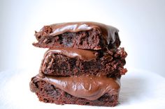 three chocolate brownies stacked on top of each other