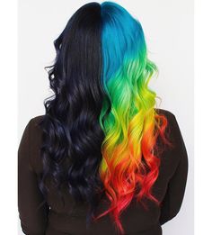 the back of a woman's head with multi - colored hair and black top