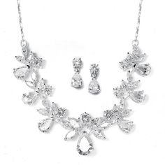 CZ Bridal Jewelry Set 578SThis glistening bridal necklace and earrings set in silver plating will be an elegant accessory for your wedding day. It features brilliant teardrop, round and marquise cubic zirconia crystals to make a beautiful bridal or prom accessory. A delicately twisted rose gold chain completes the look.Size: Necklace extends from 15" to 18" long. The dainty pierced CZ drop earrings measure 3/4" long.Color: Silver.Style: 578S.Perfect for weddings, proms, homecoming and quinceaner Winter Bridal Jewelry, Gold Diamond Hoop Earrings, Black Diamond Earrings, Bridal Accessories Jewelry, Bridal Necklace Set, Bridal Jewelry Set, Nickel Free Earrings, Bridesmaid Jewelry Sets, Cz Necklace