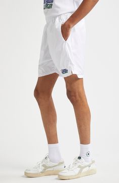 Serve your best style game on and off the court in these sporty tennis shorts equipped with side-seam pockets that hold three tennis balls each. This piece is part of a Nordstrom-exclusive capsule that pays tribute to two former tournament sites—Newport Casino and Forest Hills. Elastic waist Side-seam pockets 100% polyester Machine wash, line dry Made in Portugal Designer Clothing White Nylon Athletic Shorts With Built-in Shorts, White Sports Shorts With Short Inseam, Sporty White Shorts With Short Inseam, White Athletic Shorts With Built-in Shorts, Relaxed Fit, White Athletic Shorts With Short Inseam For Sports, White Nylon Shorts For Streetwear, White Nylon Athletic Shorts For Streetwear, Tennis Athletic Shorts With Built-in Shorts, White Athletic Shorts With Built-in Shorts