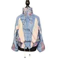 Good Vintage Condition - Regular Wear Consistent with Age Embrace the retro vibes with this vintage 90s windbreaker jacket, featuring a stylish colorblock design in pastel shades of blue, pink, and cream. This medium-sized jacket is perfect for those who love to add a touch of nostalgia to their wardrobe. The lightweight fabric and drawstring details make it an ideal choice for breezy days and outdoor adventures. - Size: Medium - Color: Blue with pink and cream accents - Material: Lightweight ny Pink Windbreaker, 90s Windbreaker, Snow Angel, Spring Jackets, 90s Retro, Pastel Shades, Patchwork Designs, Cool Fashion, Womens Jackets