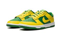 The Nike Dunk Low “Reverse Brazil” is a two-tone, yellow-and-green colorway of the retro basketball shoe that flips the color scheme of the model’s popular “Brazil” style.  As its name suggests, the “Reverse Brazil” reverses the color coordination of the “Brazil” Dunk, and it doesn’t miss the mark.  The shoe features Yellow Strike leather overlays and Swoosh branding on an Apple Green-colored leather base.  A green “Nike” logo is embroidered on the yellow leather heel tab.  Classic “Nike” detail Nike Dunks Yellow, Nike Dunks Vintage Green, Green And Orange Dunks, Dunk Low Brazil, Yellow And Green Dunks, Brazil Dunks, Brazil Style, Green Jordans, Sb Dunks