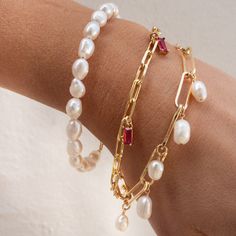 Our Cora Pearl Bracelet is so simple yet absolutely eye-catching. What do we love about it? This bracelet is timeless and modern - perfect as a gift or gifted to yourself! BRACELET FEATURES Small Genuine Freshwater Baroque Pearls Choice of Yellow Gold, Rose Gold or Sterling Silver Finish Bracelet includes a 1" extender All bracelet findings (clasp, end tags, jump rings) and extender chain are 100% gold filled or sterling silver to ensure the highest quality piece Bracelet available in 2 sizes: S Modern Charm Bracelet, Pearl Bracelet Making, Gold Bracelet With Charms, Charms Bracelet, Pearl Bracelet Stack, Bridesmaid Pearl Bracelet, Pearl Charm Bracelet, Gold Pearl Bracelet, Chunky Pearls