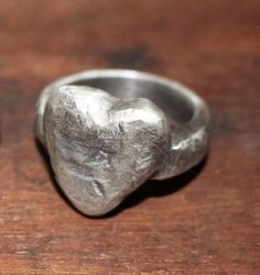 Handmade 925 sterling silver distressed heart ring. Hammered and oxidised with a satin finish. The heart is approximately 18mm x 18mm.  3 sizes available. P, Q, R1/2.  All the rings are cast from the same piece, but because of the method used each ring will have it's own individual markings. Approx weight from 16g - 20g. Hallmarked. Finish The Heart, Handmade Silver Rings, Art Clay Silver, Nail Jewels, Handmade Silver Ring, Gold And Silver Rings, Dope Jewelry, Casting Jewelry, Classy Jewelry