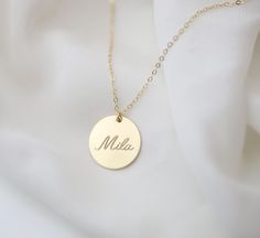 Personalized large circle disk tag necklace in Gold filled or Sterling silver. Have this custom necklace personalized with your child's name, your name, initials or any meaningful word of your choice. This necklace is perfect for a special meaningful keepsake gift for mom, friend wife or that special someone. OPTIONS Material: SS// for Sterling silver GF// for Gold filled Disk size : 16mm // 19mm Cubic Zirconia charm: You can choose from the drop down bar menu to add a 4mm CZ charm PLEASE READ B Personalized Adjustable Sterling Silver Initial Necklace, Minimalist Custom Necklace For Mother's Day, Minimalist Customizable Necklace For Mother's Day, Personalized Adjustable Medallion Jewelry, Minimalist Customizable Necklace As Personalized Gift, Customized Round Jewelry For Everyday, Adjustable Personalized Medallion Jewelry, Customized Jewelry For Everyday Wear, Personalized Name Necklace With Round Pendant