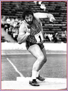 an old photo of a man running on a track with the words sporting heroes in front of him