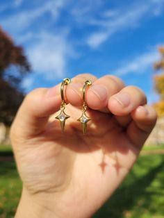 Materials:  Hoop- stainless steel (in gold color) Charm- 18k gold plated CZ star drop Item Details: The earrings are for 1 PAIR and only come in the CLIP ON version for NON PIERCED ears. These stainless steel clip on hoop earrings use a spring closure and look very realistic (like pierced earrings).  US customers: Receive FREE US shipping by making an order of $35 or above from my shop. Non-US customers: If you order multiple items from my shop at once, the shipping cost will be for one piece. I Clip On Earrings Dangle, Dangly Clip On Earrings, Clip On Dangle Earrings, Aesthetic Clip On Earrings, Gold Stainless Steel Dangle Hoop Earrings, Gold Stainless Steel Hoop Earrings, Gold Plated Star Hoop Earrings Tarnish Resistant, Gold Plated Star Hoop Earrings, Gold Plated Star Shaped Hoop Earrings