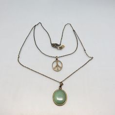 This vintage  Lucky Brand layered 2 pendant necklace is a perfect necklace for everyday.  The length around the neck line is 19 inches with a lobster claw clasp closure.   The peace sign pendant measures 1 3/8ths inches high by 7/8ths inches wide.  The lovely real aventurine pendant measures 1 5/8ths inches high by 1 inch wide.   Both pendants are reversible for a totally different all gold look.   The Aventurine pendant hangs down 3 1/2 inches from the peace sign.    The tiny Lucky Brand four l Necklace For Everyday, Pendants Necklace, Bolo Ties, Clover Charm, Southwestern Style, The Peace, Aged Brass, Leaf Clover, Four Leaf Clover