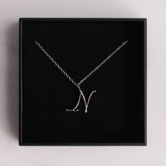 "Silver N Pendant / Silver letter N Necklace / Dainty silver chain necklace / initial necklace / sterling silver chain / personalized jewelry Dainty \"N\" initial. Perfect every day necklace. Lovely gift for your self, sister, bridesmaids, new mom. Convo me if you would like to customize the length of the chain. The possibilities are endless. Pendant: Base metal is brass and silver plated. Chain is 18 inches, sterling silver. (if you would like a longer or shorter chain, please contact us to cus Minimalist Silver Initial Pendant Necklace, Silver Minimalist Initial Necklace, Silver Minimalist Personalized Initial Necklace, Silver Chain Initial Pendant Necklace As Gift, Minimalist Silver Initial Necklace, Silver Chain Necklace With Initial Pendant As Gift, Minimalist Silver Monogram Necklace, Silver Monogram Name Necklace In Minimalist Style, Silver Minimalist Initials Name Necklace