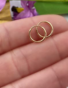 14K Solid Gold Hoop Earrings - 14K Endless Hoops, Hoop Earring, Small Hoops, Thin Hoop Earrings, Dainty Hoop, Dainty Gold Earrings. Dainty endless hoop earrings, simple and beautiful! These endless hoops are perfect for everyday wear. ✦Price is for a pair of earrings, if you only need please message me. ✦Endless hoops measure 10mm or 12mm and 14K yellow gold 🎁 Comes ready to gift in a gift box or bag. ♥BUY WITH CONFIDENCE♥ Please know I take customer service very seriously! There is nothing I w Small Gold Hoop Earrings Simple, Gold Tiny Hoop Earrings, Small Hoop Gold Earrings, Small Ring Earrings Gold, Simple Gold Round Earrings, Gold Earrings Indian Daily Wear, Dainty Nose Ring, Minimalist Accessories Jewellery, Small Hoops Earrings