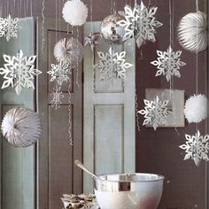 the cover of home and garden essentials, with snowflakes hanging from the ceiling