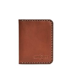 Classic design Handmade Full grain vegetable tanned premium leather ID slot 2 card slots Outside compartment Flat bill section Imported This wallet is a stylish and minimalist accessory that is perfect for those who value both fashion and functionality. Crafted from top-quality leather, it is durable and develops a beautiful patina as it ages. With 2 card slots, a slot for DL/ID, an outside compartment, and extra compartments for bills and receipts, it is practical for everyday use and can help Classic Trifold Wallet With Waxed Finish, Cognac Trifold Wallet With Card Slots For Everyday Use, Classic Waxed Trifold Wallet, Everyday Trifold Wallet With Waxed Finish, Everyday Waxed Finish Trifold Wallet, Cognac Leather Trifold Wallet, Rectangular Cognac Leather Trifold Wallet, Cognac Leather Rectangular Trifold Wallet, Rectangular Vegetable Tanned Leather Wallet