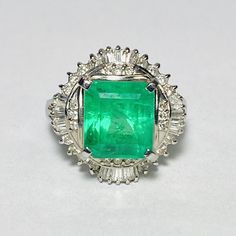 GG Certified 900 Platinum Emerald Diamond Cocktail Ring Size 7  1 Rectangular step-cut emerald, measuring approx. 9.80 x 8.91 x 7.38 mm  Color: Bluish-green Clarity: Transparent Approx. carat weight: 4.30ct * Natural emerald, fracture-filled  26 Round brilliant cut diamonds, measuring approx. 1.00-1.20 mm  Color: H-J Clarity: VS-SI Approx. total carat weight: 0.20cttw  * Natural diamond 20 Baguette cut diamonds, measurement approx. 2.00 x 1.25 x 1.00 mm  Color: H-J Clarity: VS-SI Approx. total c Diamond Cocktail Ring, Step Cut, Top Measurements, Diamond Cocktail Rings, Baguette Cut Diamond, Bluish Green, Health Wealth, Emerald Jewelry, Fantasy Jewelry