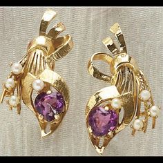 14k Yellow Gold Screw Back Earrings Depicting A Floral Bouquet Design. Each Earring Is Set With One Heart Shaped Faceted Amethyst Measuring 7mm And Four 2.5mm Pearls. 1 And 3/8 Inches And 8.6 Grams. In Very Excellent Condition! Purple Fine Jewelry Earrings For Formal Occasions, Elegant Purple 14k Gold Earrings, Elegant Purple Clip-on Earrings, Formal Purple Clip-on Jewelry, Vintage Amethyst Purple Earrings, Purple 14k Gold Earrings With Prong Setting, 14k Gold Purple Earrings With Prong Setting, Bouquet Design, Amethyst Earrings