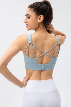 80% Nylon. 20% Spandex Soft. comfortable. skin friendly 4-way stretch. breathable and sweat-wicking Classic U-shape neckline Crisscross straps that offer intricate detailing to your look Featuring non-removable pads for built-in comfort and support Perfect for both sports activities and daily life Cross Back Sports Bra With Straps For Yoga, Stretch Sports Bra With Built-in Padding And Tank Straps, Strappy Gym Tops With Built-in Bra, Compressive Strappy Sports Bra With Light Support, Fitted Crisscross Activewear With Built-in Bra, Strappy Compressive Sports Bra With Light Support, Strappy Sports Bra For Light Exercise, Strappy Athleisure Sports Bra For Light Exercise, Athleisure Strappy Sports Bra For Light Exercise