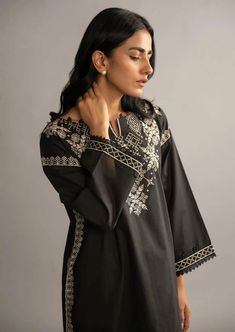 Women Kurta (Shirt Only). Description A solid black look with modern day style embedded on traditional canvas with elegant embroidery on fine lawn fabric. A day to day solid statements from Dhanak’s black and white collection. Black Embroidered Fabric For Designer Wear During Eid, Traditional Dabka Tops, Black Blouse With Resham Embroidery For Festive Occasions, Black Tops With Resham Embroidery For Festive Occasions, Festive Black Blouse With Resham Embroidery, Designer Cotton Tops For Eid, Black Tops With Resham Embroidery For Festive Season, Traditional Black Blouse With Resham Embroidery, Festive Black Embroidered Top With Floral Details