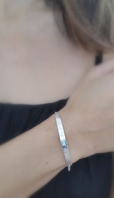 "Elegant and modern, this gorgeous coordinate bracelet is a great dress up dress down piece. A simple way to remember a special place, home town, proposal site, favorite vacation spot, etc. You can have this in sterling silver, 14k yellow goldfill or 14k rose gold fill. I can convert any address or location into gps coordinates for you. If you would like to have the backside personalized, please make sure to select the option for backside engraving in the dropdown menu. Maximum characters is 25 Elegant Adjustable Cuff Bracelet For Friendship, Modern Sterling Silver Friendship Bracelets, Elegant Sterling Silver Bracelet For Friendship, Minimalist Engraved Bracelets For Friendship, Elegant Bangle Bracelet For Friendship, Elegant Bangle Bracelets For Friendship, Minimalist Engraved Name Bangle Bracelet, Elegant Sterling Silver Chain Bracelet For Friendship, Elegant Silver Name Bangle Bracelet