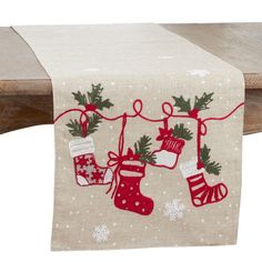 a christmas stocking and stockings table runner