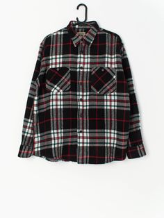 Vintage plaid flannel shirt in black, red and white. This shirt features two chest pockets, long sleeves and an extremely soft fleece-style material to keep you warm and toasty this winter! Made from a lovely lightweight soft fabric.  Our recommended size: Large  Label says: Large  Condition: Very good  Material: No care label, feels like a synthetic material  Measurements in inches, laid flat: Pit to pit: 24 Shoulders: 19.5 Front length: 29.5 Back length: 29.5 Sleeve length:24.5 We recommend th Black Long Sleeve Flannel Shirt, Black Relaxed Fit Collared Flannel Shirt, Black Collared Flannel Shirt With Pockets, Black Collared Flannel Shirt For Winter, Winter Plaid Long Sleeve Shirt, Black Flannel Long Sleeve Outerwear, Black Flannel Shirt With Pockets For Winter, Black Winter Flannel Shirt With Pockets, Black Long Sleeve Flannel Shirt For Fall