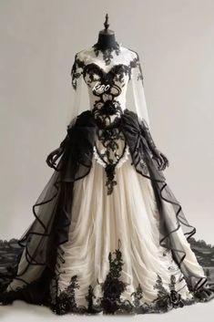 Gothic Black and Ivory Wedding Dresses with Long Sleeves High Neck Bridal Gowns.  "This pin contains affiliate links, which means I may earn a commission at no cost to you extra for you". 
 #affiliate #advertising"