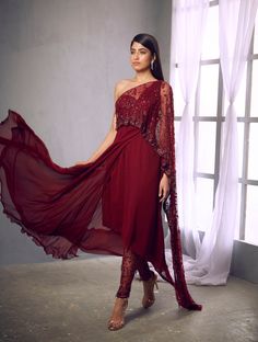 Maroon kurta with an embroidered drape and a pair of embroidered pantsFrom Shloka Khialani' s Fiorente collection.DELIVERY TIMEPlease allow 6-8 weeks for your outfit to arrive.FABRIC DETAILSSilk, Crepe, Georgette, NetProfessional cleaning only. Traditional Pant Set With Sheer Dupatta For Party, Festive Pant Set With Sheer Dupatta, Traditional Drape Pant Set For Diwali Reception, Bollywood Style Pant Set With Sheer Dupatta For Festivals, Festive Pant Set With Sheer Dupatta For Navratri, Eid Kurta With Sheer Dupatta And Cape Sleeves, Festive Pant Set With Sheer Dupatta For Festivals, Festive Kurta With Sheer Dupatta And Cape Sleeves, Navratri Traditional Wear With Dupatta And Cape Sleeves