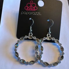 New. Paparazzi Brand. Silver Crystal Bling Earrings, Silver Jeweled Crystal Earrings For Party, Silver Metal Crystal Earrings With Bling, Elegant Silver Jeweled Hoop Earrings, Silver Crystal Party Earrings, Silver Jeweled Crystal Earrings With Cubic Zirconia, Silver Jeweled Crystal Earrings, Silver Crystal Earrings With Rhinestones, Silver Sterling Crystal Earrings With Bling