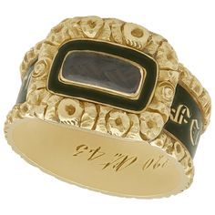 An impressive antique Victorian 1840s black enamel and 14 karat yellow gold mourning ring with hair; part of our diverse antique jewelry and estate jewelry collections. This fine and impressive antique Victorian mourning ring has been crafted in 14k yellow gold. The intricate design is ornamented with a push fit panel to the centre, displaying a woven hair panel. The woven hair panel is bordered by a plain black enamel decoration within a three dimensional floriated frame. The shank of the ring Victorian Hair Jewelry, Antique Ring Box, Victorian Hair, Zsa Zsa, Momento Mori, Ring Boxes, Romantic Jewellery, Punk Vintage, Victorian Rings