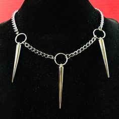 Punk Rock Triple Spikes Necklace Choker O Ring Necklace O-Ring Thorns Pendants On Silver Color Curb Chain Necklace Choker. Approximate Length 18” Width 5mm. Material: Steel Chain, Silver Or Stainless Steel Color Plated Alloy Spikes And Oring , Spikes Punk Length: 2” Spikes Are Hollow Light Weight O-Ring Diameter: 15mm Please Be Aware That The Items Have Spikes. Please Be Cautious And Be Careful In Using Them. By Purchasing The Items, You Are Aware And Take Your Own Risk Of Anything Involved In U Rock Style Jewelry Choker For Alternative Fashion, Rock Style Choker Jewelry For Alternative Fashion, Rock Style Choker For Alternative Fashion, Punk Choker Necklace For Concerts, Punk Style Necklace With Adjustable Chain For Streetwear, Punk Style Adjustable Chain Necklace For Streetwear, Punk Gold Stainless Steel Jewelry, Punk Metal Jewelry For Concerts, Punk Chain Necklace For Streetwear