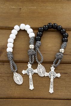 This listing includes two (2) single decade pocket rosaries. Looking for the perfect wedding gift for a newly wedded Catholic couple? Look no further than our "Together In Prayer" Paracord Rosary Set. Made with durable paracord 550 rope, these rosaries are built to last and stand the test of time, just like the couple's love for each other. Each rosary features a 2" St. Benedict crucifix making it comfortable in a pocket or purse.Each rosary also includes a Miraculous Medal, a powerful symbol of Catholic Couple, Rosary Craft, Small Rosary, Wedding Rosary, Paracord Rosary, Rosary Jewelry, Catholic Crafts, Holy Matrimony, Gift For Newlyweds