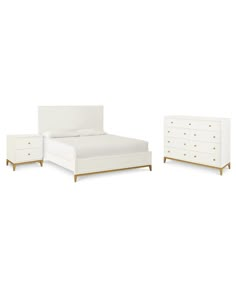 a white bed with two nightstands and a night stand