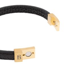 The Grady is a handmade bracelet featuring a slim cowhide leather strap. The design is comfortable, minimalist, straightforward, and stylishly refined.- WIDTH: 8 mm- MATERIAL TYPE: 100% genuine pebbled cowhide leather- CLASP COLOR: Brushed gold- CLASP MATERIAL: 316L stainless steel, 18K gold PVD plated- CLASP TYPE: Magnetic Classic Adjustable Leather Bracelet For Everyday, Classic Adjustable Braided Leather Bracelet, Classic Leather Bracelets For Everyday, Luxury Leather Bracelets For Business, Classic Yellow Gold Leather Bracelet, Classic Adjustable Leather Bracelet With Wrist Strap, Luxury Gold Leather Bracelets, Modern Adjustable Leather Bracelet With Wrist Strap, Modern Yellow Gold Leather Bracelet